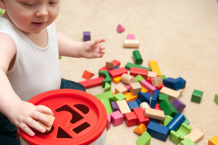baby playing with blocks and sorting shapesの写真素材