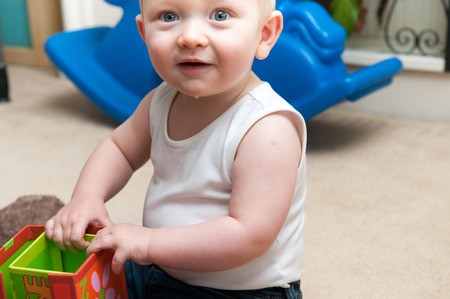 baby playing with blocks to make a tower, happy baby boyの写真素材