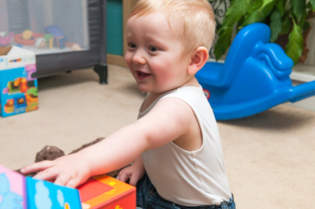 baby playing with blocks to make a tower, happy baby boyの写真素材