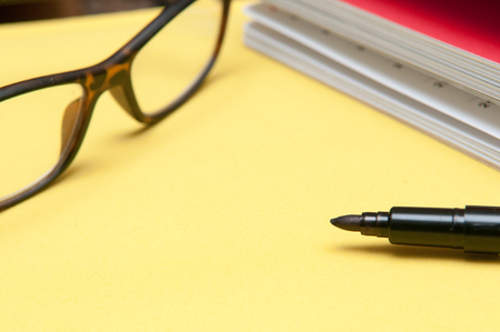 Office desk with notepad and copy space, modern layoutの写真素材
