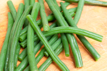 Fresh green beans cooking in waterの写真素材