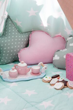 Children's bedroom interior with tea set and toysの写真素材
