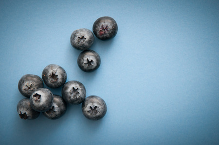 Blueberry isolated on blue, rich in antioxidantsの写真素材