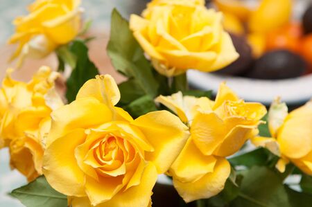 arrangement of yellow roses in natural lightの写真素材