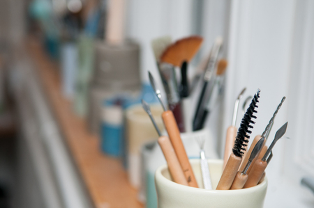 Artists tools for pottery and ceramic making in the workshopの写真素材