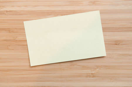 blank paper note on a table with copy space to add your own textの写真素材
