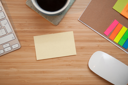 blank paper note on a table with copy space to add your own textの写真素材