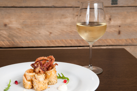 Calamari freshly prepared seafood on a white plateの写真素材