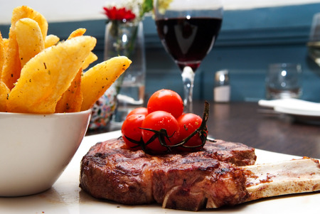 steak and chips meal in the restaurantの写真素材