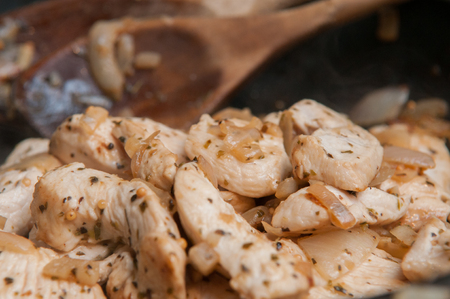 Seasoned Fresh Chicken pieces cooking in the frying panの写真素材