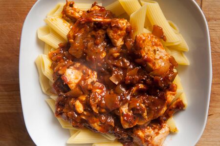 Italian pasta meal served in a white bowlの写真素材