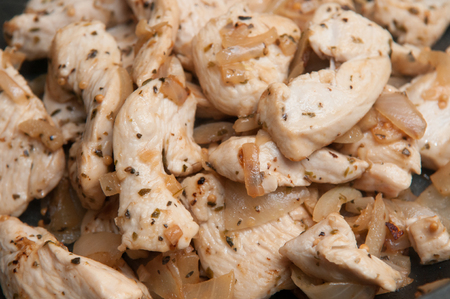Seasoned Fresh Chicken pieces cooking in the frying panの写真素材