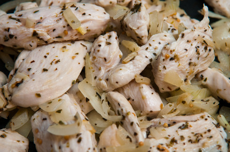 Seasoned Fresh Chicken pieces cooking in the frying panの写真素材