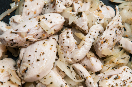 Seasoned Fresh Chicken pieces cooking in the frying panの写真素材