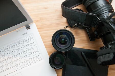 Professional photography editing equipment with camera and laptopの写真素材