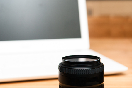 Professional photography editing equipment with camera and laptopの写真素材