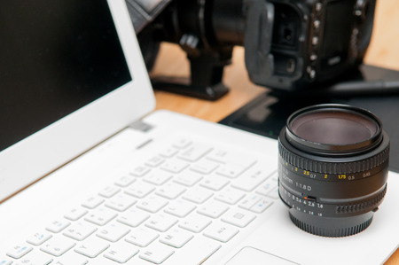 Professional photography editing equipment with camera and laptopの写真素材
