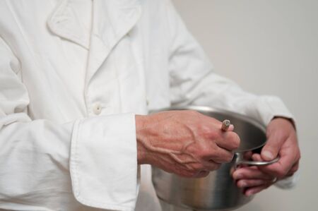 chef preparing food cooking with a panの写真素材