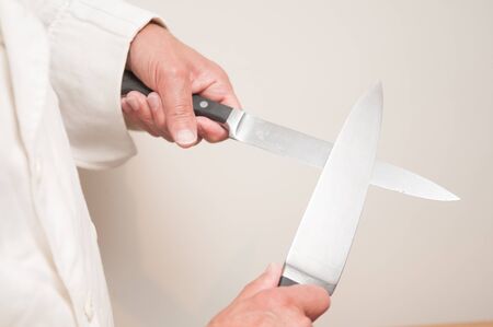 chef using knife held in front of him