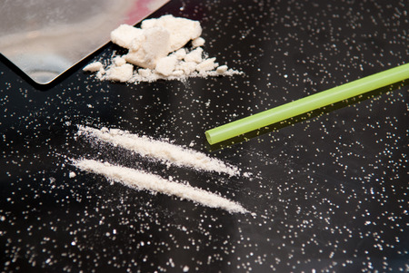 Drug abuse, cocaine chopped and in lines to be takenの写真素材