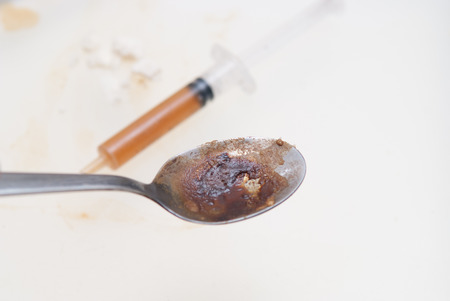 drugs and substance abuse, cooked heroin and syringeの写真素材