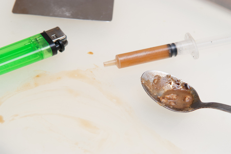 drugs and substance abuse, cooked heroin and syringeの写真素材