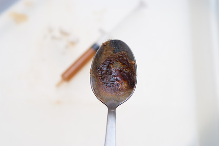 drugs and substance abuse, cooked heroin and syringeの写真素材