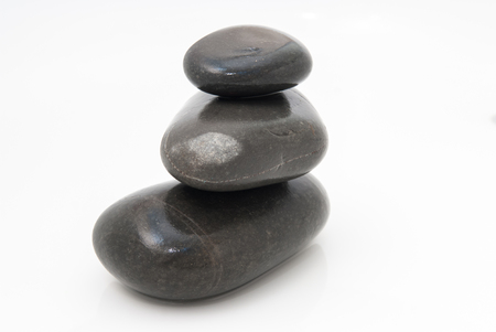 Spa treatment background of pebbles and running waterの写真素材