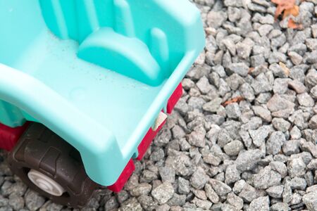 toy tipper truck moving gravel building materialsの写真素材