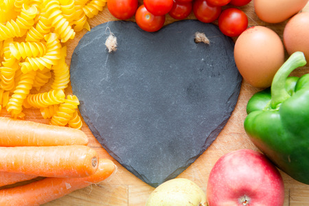 Food groups, natural healthy fruit and vegatables with a heart shapeの写真素材