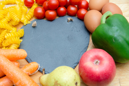 Food groups, natural healthy fruit and vegatables with a heart shapeの写真素材