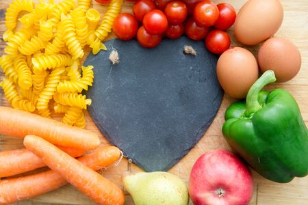 Food groups, natural healthy fruit and vegatables with a heart shapeの写真素材