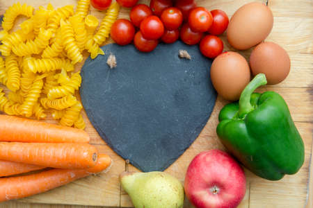 Food groups, natural healthy fruit and vegatables with a heart shapeの写真素材