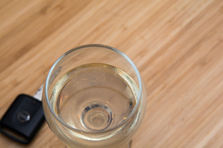 drink driving, alcoholic drink and car keys on the tableの写真素材