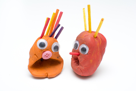 fun modelling clay figures with shocked expression on isolated white backgroundの写真素材