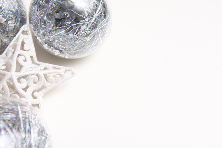 White christmas background with bauble and star christmas decorationsの写真素材