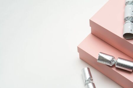 Christmas presents in gift wrap on white backgroundの写真素材