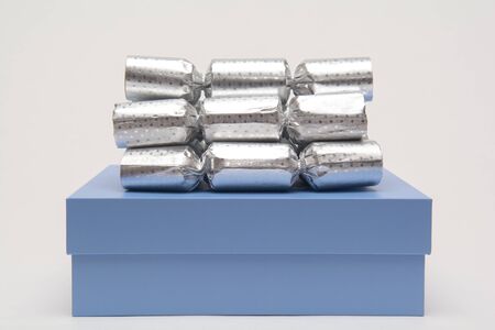 Christmas presents in gift wrap on white background in gift wrap on a white backgroundの写真素材