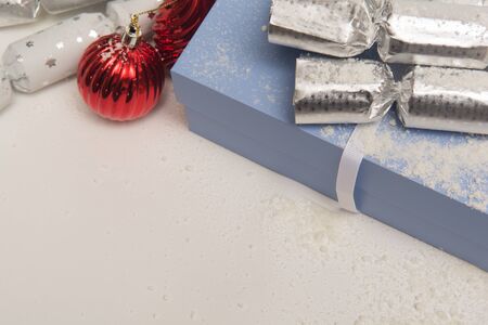 Christmas presents in gift wrap on white background in gift wrap on a white backgroundの写真素材
