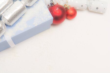 Christmas presents in gift wrap on white background in gift wrap on a white backgroundの写真素材