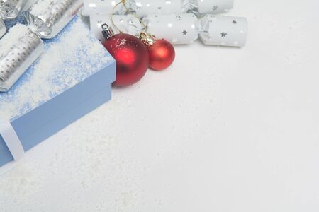 Christmas presents in gift wrap on white background in gift wrap on a white backgroundの写真素材