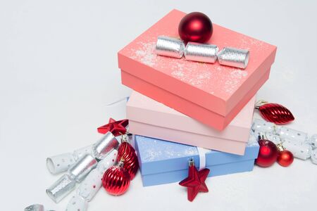 Luxury Christmas gifts in boxes with festive decorationsの写真素材