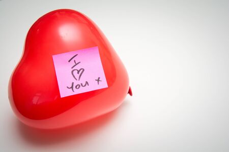 Love message for Valentines hand written note on a heart shape balloonの写真素材
