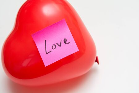 Love message for Valentines hand written note on a heart shape balloonの写真素材