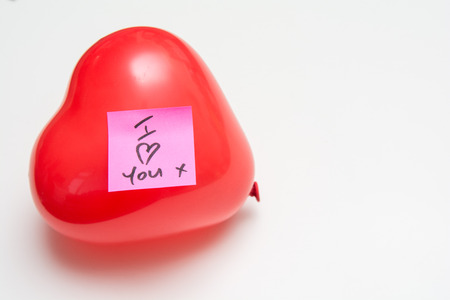 Love message for Valentines hand written note on a heart shape balloonの写真素材