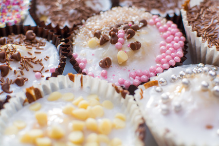 Home made cupcakes baked and decorated by kidsの写真素材