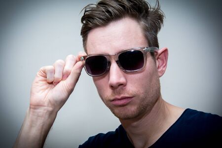 Man wear shades on white backgroundの写真素材
