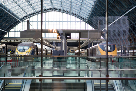 Modern railway platform in London with waiting trainsのeditorial素材