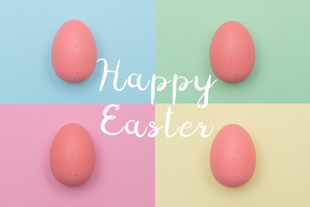 Easter eggs and text on pastel color backgroundの写真素材
