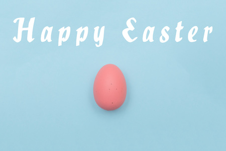 Easter eggs and text on pastel color backgroundの写真素材